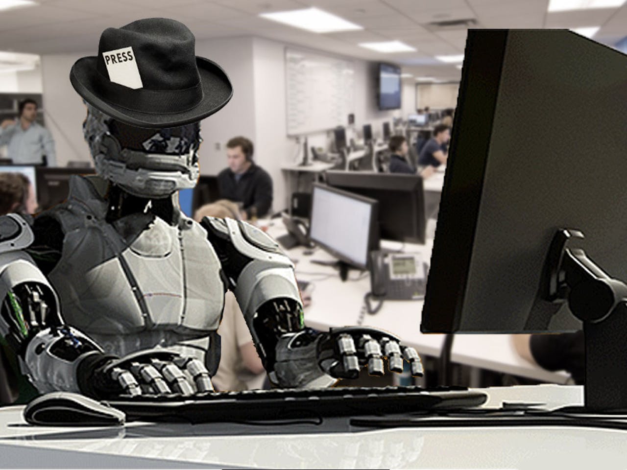 Aan een bureau zit een robot met een hoed op.