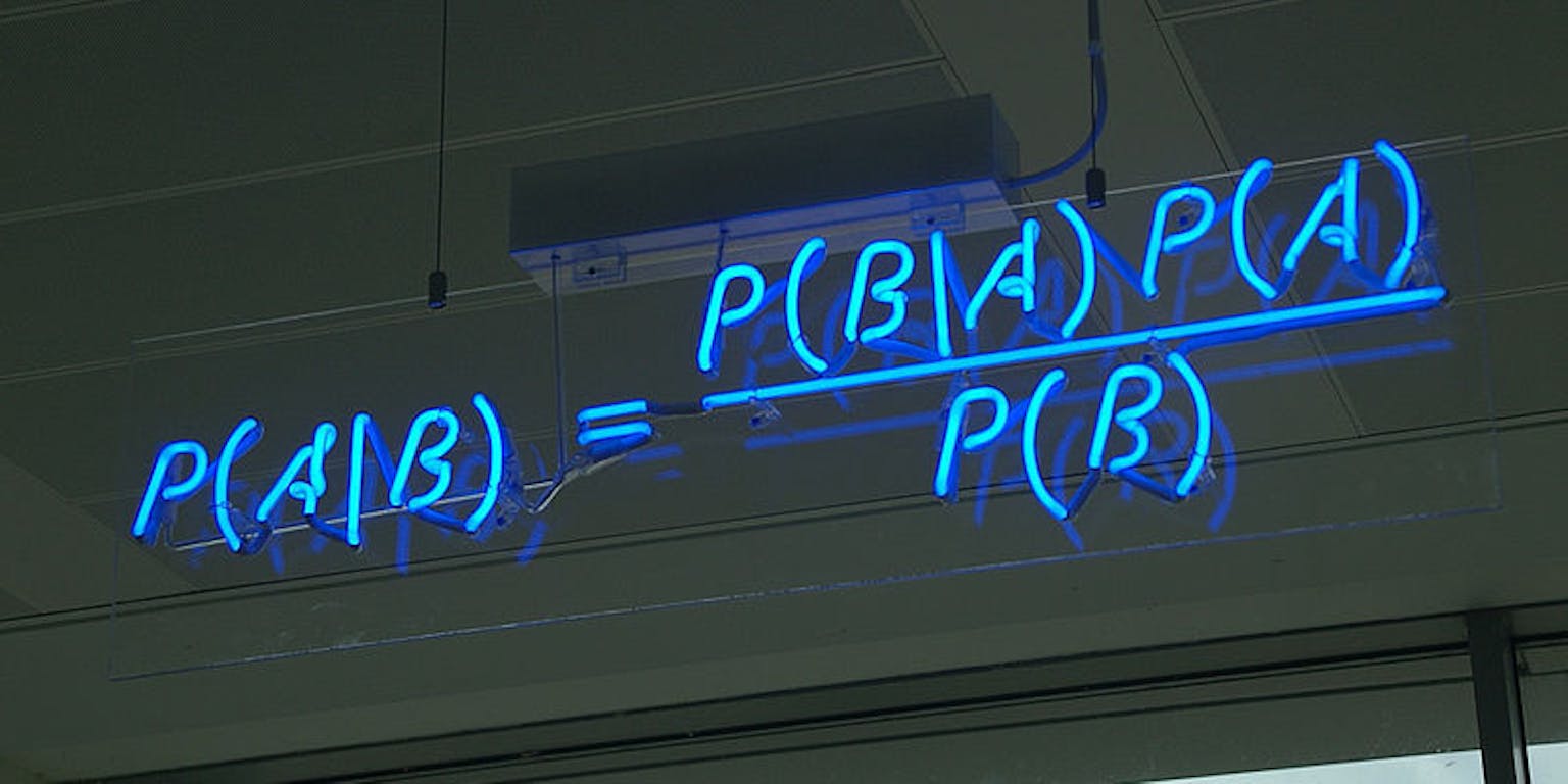 Een neonbord met daarop de P(A\B) formule weergegeven.
