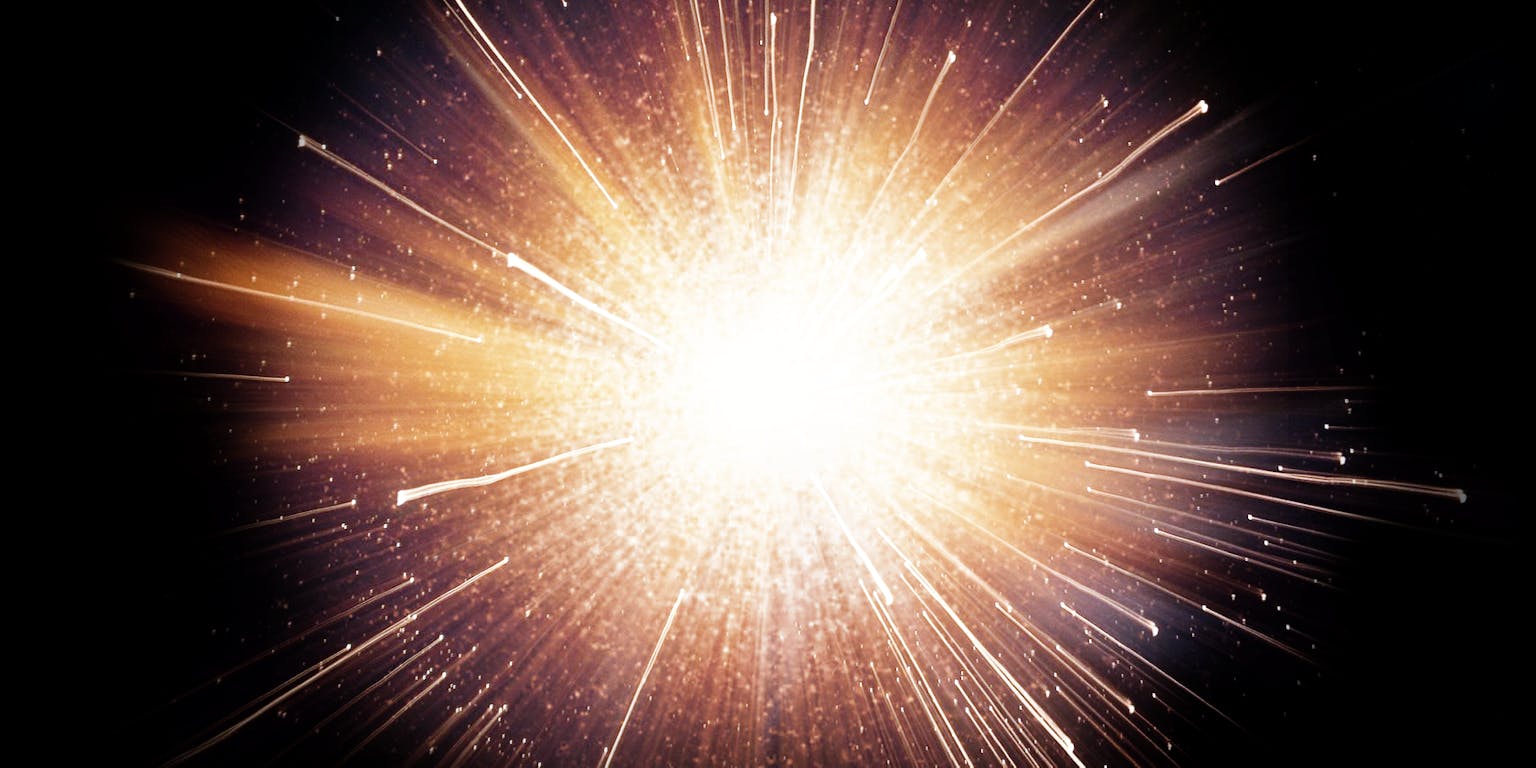 Een uitbarsting van licht op een zwarte achtergrond.