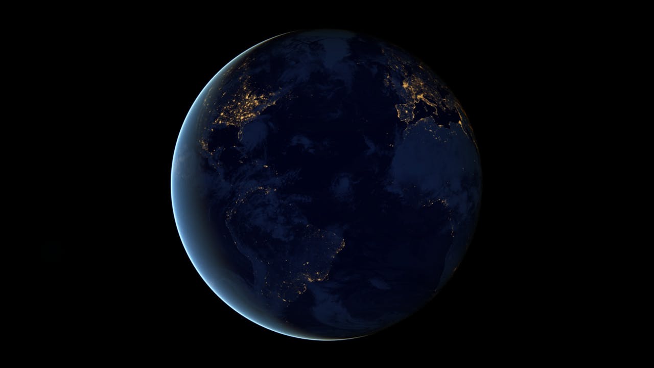Een beeld van de aarde bij nacht.