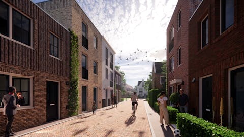 Impressie van een straat met modulair gebouwde woningen van twee en drie verdiepingen met een plat dak. Impressie van een straat met modulair gebouwde woningen van twee en drie verdiepingen met een plat dak.