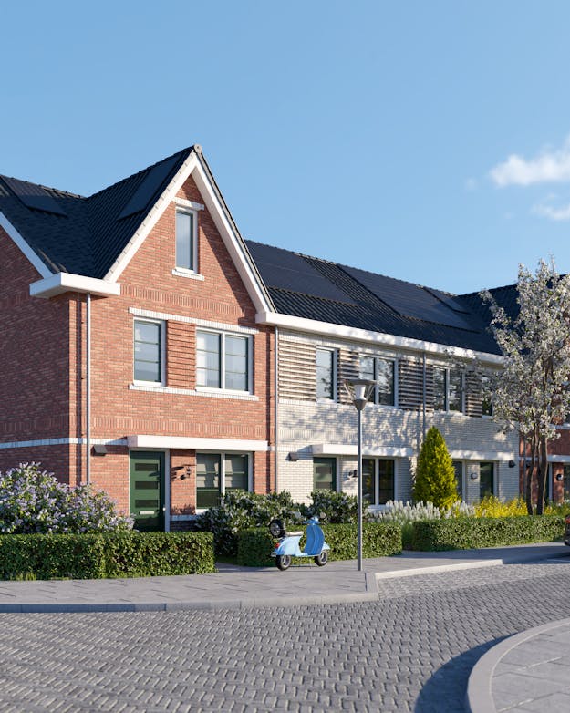 Straat met modulair gebouwde woningen Straat met modulair gebouwde woningen van drie verdiepingen met een puntdak.
