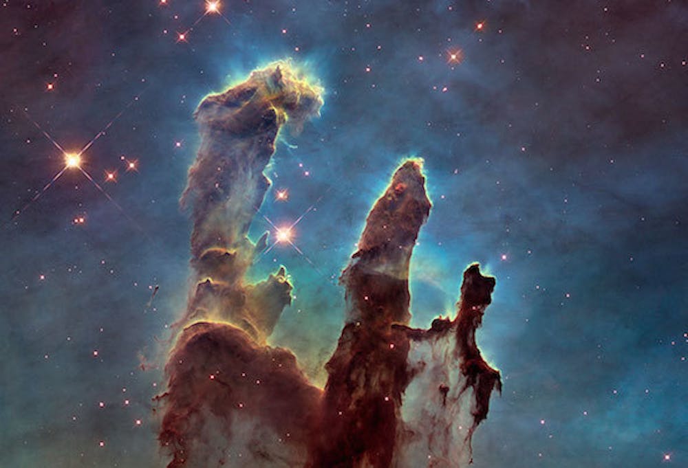 <p>De zogenoemde <em>Pillars of Creation</em> gefotografeerd door de Hubble-telescoop. </p>