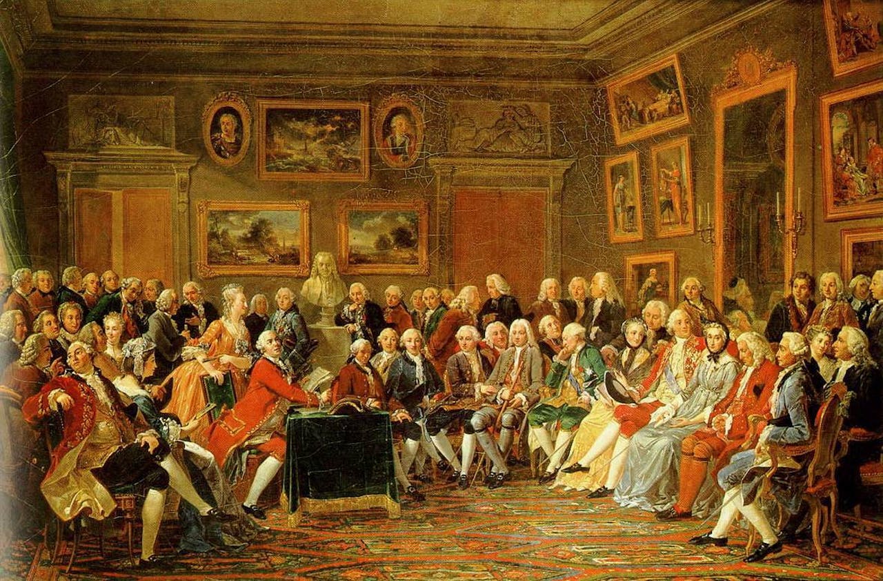 De salon van madame Geoffrin in 1812 door Anicet Charles Gabriel Lemonnier. In de Franse salons kwamen wetenschappers, letterkundigen en aristocraten bij elkaar om te discussiëren. Hier bespreken ze het boek L’Orphelin de la Chine (een drama over de Mongoolse leider Ghengis Khan en zijn zonen, geschreven door Voltaire in 1755).