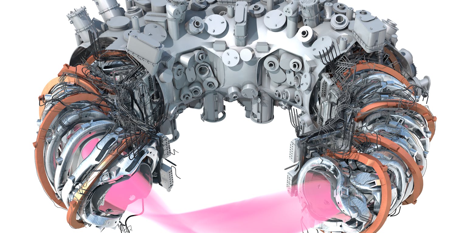 Een kijkje in een reactor. Er zijn meetinstrumenten, koperkleurige magneetringen en een vacuümkamer te zien.