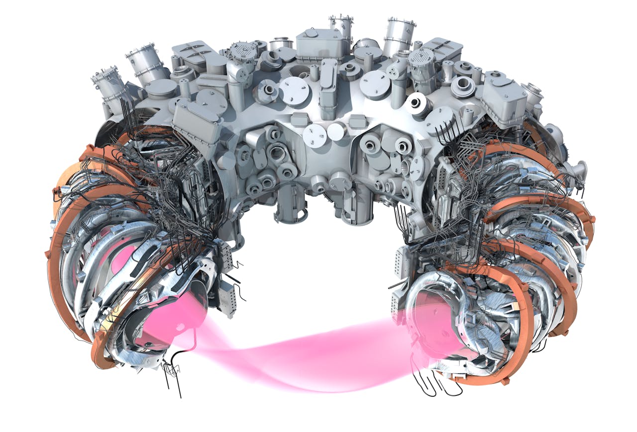 Een kijkje in een reactor. Er zijn meetinstrumenten, koperkleurige magneetringen en een vacuümkamer te zien.