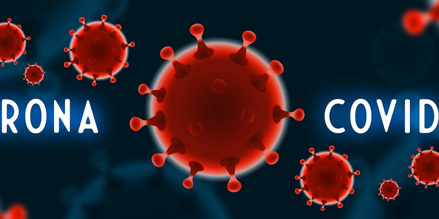 Coronavirus en het woord corona op een donkere achtergrond.