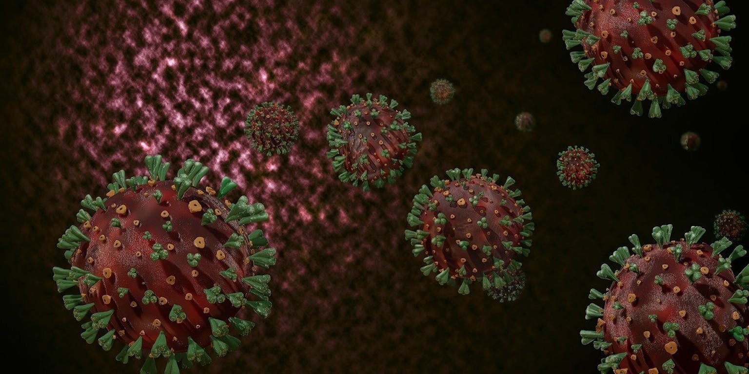 Coronavirussen op een donkere achtergrond.