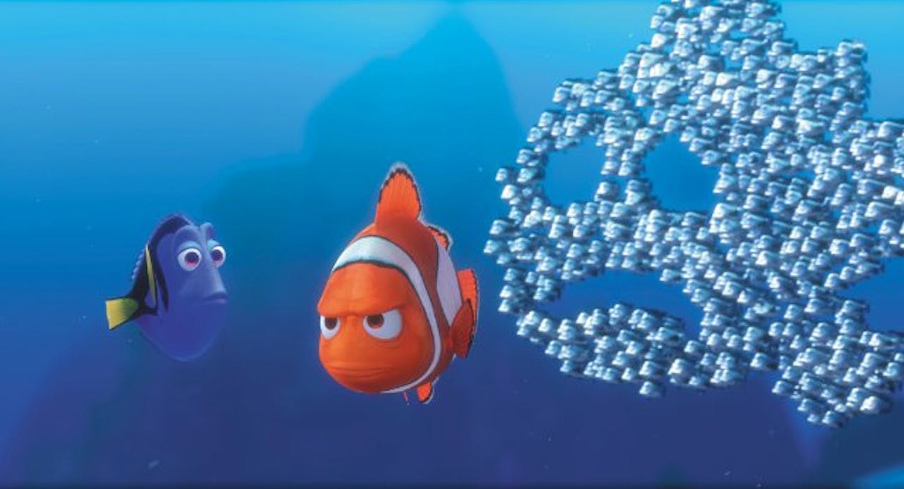 Nemo en Dory en een schaduw aan vissen op een blauwe achtergrond.